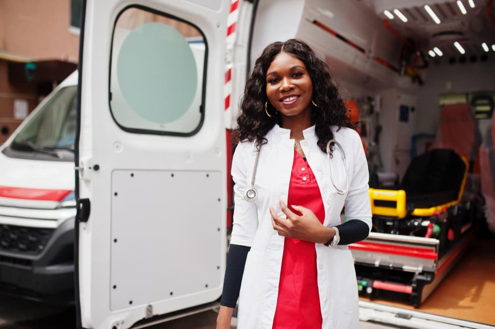 african-american-female-paramedic-standing-front-ambulance-car-2-1