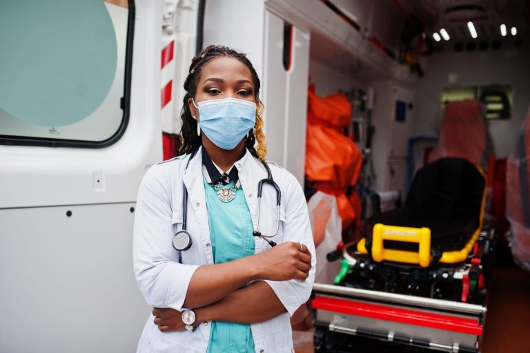 african_american_female_paramedic_face_protective_medical_mask_standing